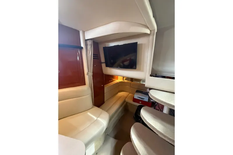 Slide: The Image of Interior of 2004 Sea Ray Sundancer 320 yacht with cozy seating and mounted TV. - 17