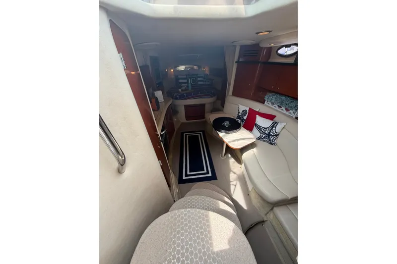 Slide: The Image of Interior of 2004 Sea Ray Sundancer 320 yacht with elegant seating and nautical decor. - 14