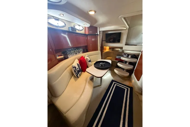Slide: The Image of Luxurious interior of 2004 Sea Ray Sundancer 320 yacht with elegant seating and decor. - 15