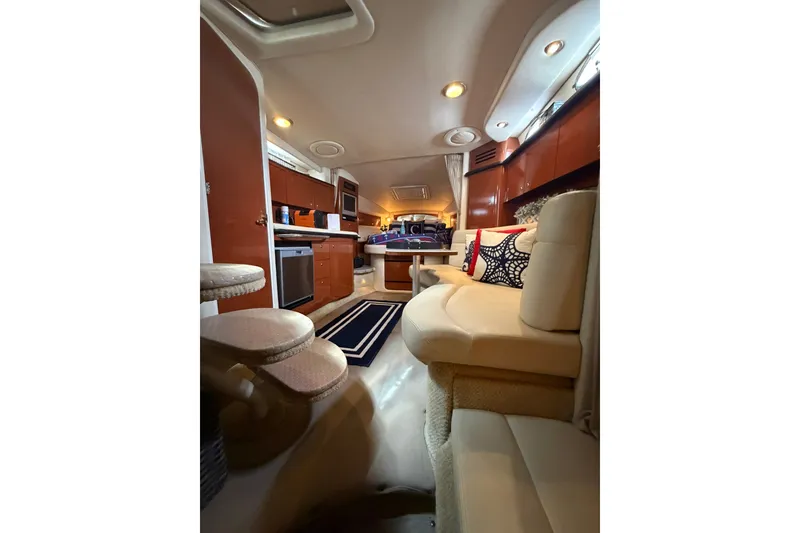 Slide: The Image of Luxurious interior of 2004 Sea Ray Sundancer 320 yacht with modern amenities and cozy seating. - 19
