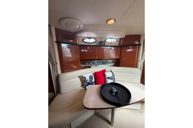 Slide: The Image of Interior of 2004 Sea Ray Sundancer 320 with elegant seating and decorative pillows. - 24