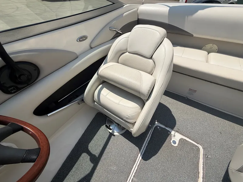 Slide: The Image of The image shows the interior of a 2005 Chaparral 190 SSi with a swiveling captain's chair. - 13