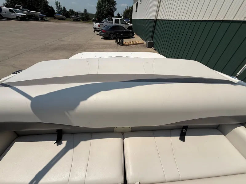 Slide: The Image of The image shows the white upholstery of a 2005 Chaparral 190 SSi, parked in a lot. - 22