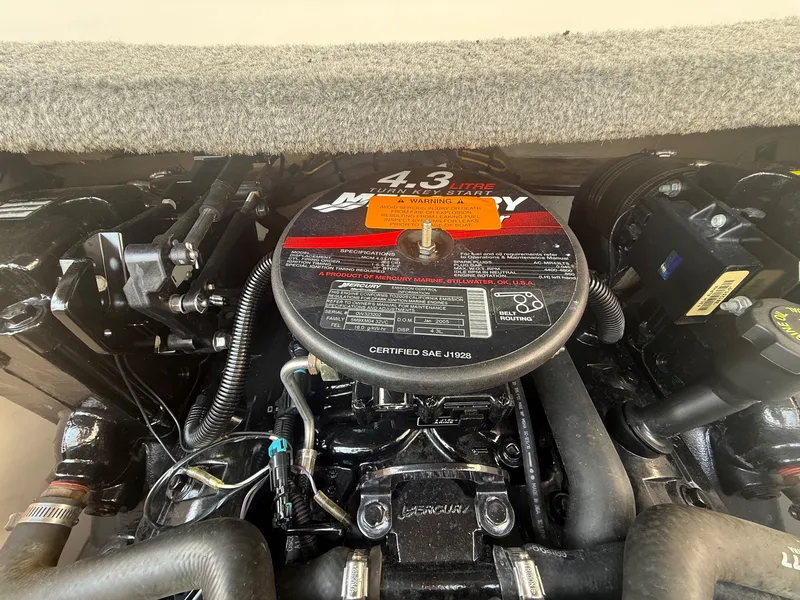 Slide: The Image of The 4.3-liter Mercury engine of a 2005 Chaparral 190 SSi is visible, with hoses and cables. - 19