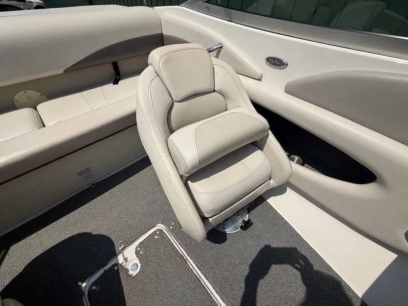 Slide: The Image of The image shows the interior of a 2005 Chaparral 190 SSi with beige seating. - 14