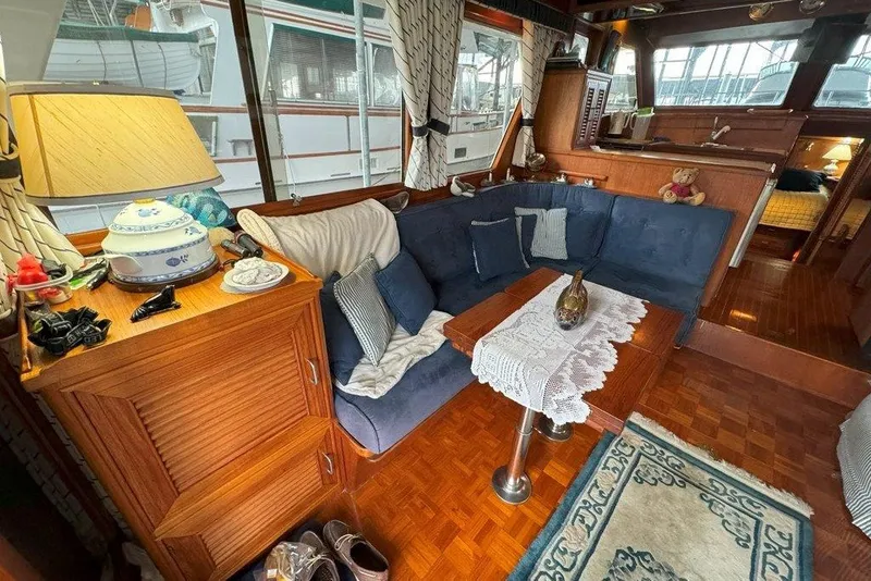 Slide: The Image of Interior of 1983 Ocean Alexander 40 Europa yacht with cozy seating and elegant decor. - 6