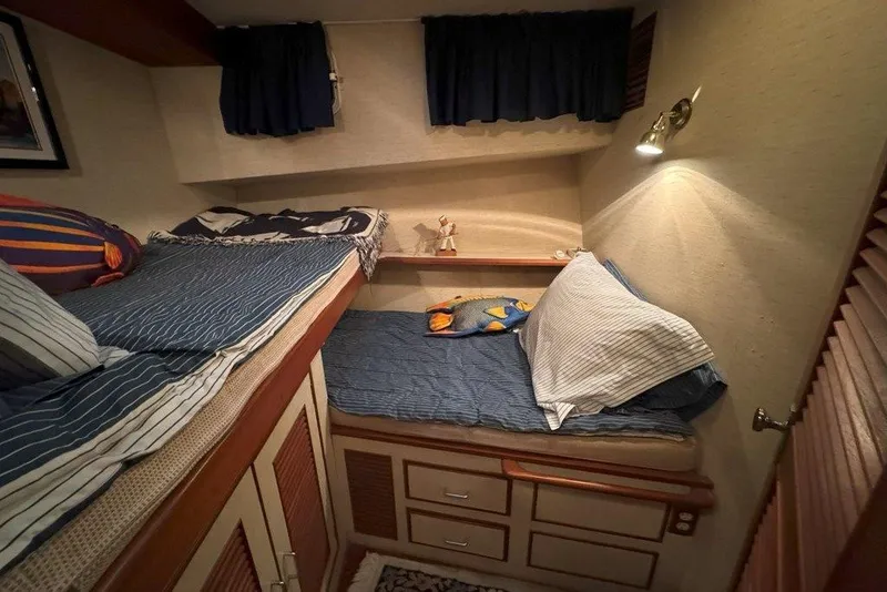 Slide: The Image of Cozy cabin interior of 1983 Ocean Alexander 40 Europa yacht with twin beds and nautical decor. - 18