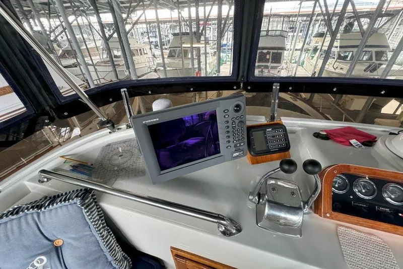 Slide: The Image of Cockpit of 1983 Ocean Alexander 40 Europa with navigation equipment and controls. - 42