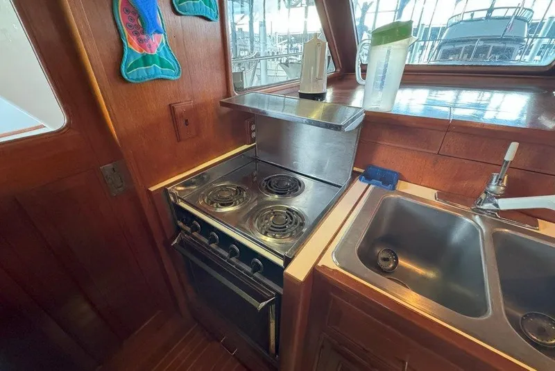 Slide: The Image of Galley kitchen in 1983 Ocean Alexander 40 Europa yacht with stove and sink. - 11