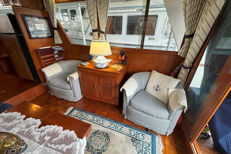 Slide: The Image of Interior of 1983 Ocean Alexander 40 Europa yacht with cozy seating and nautical decor. - 4