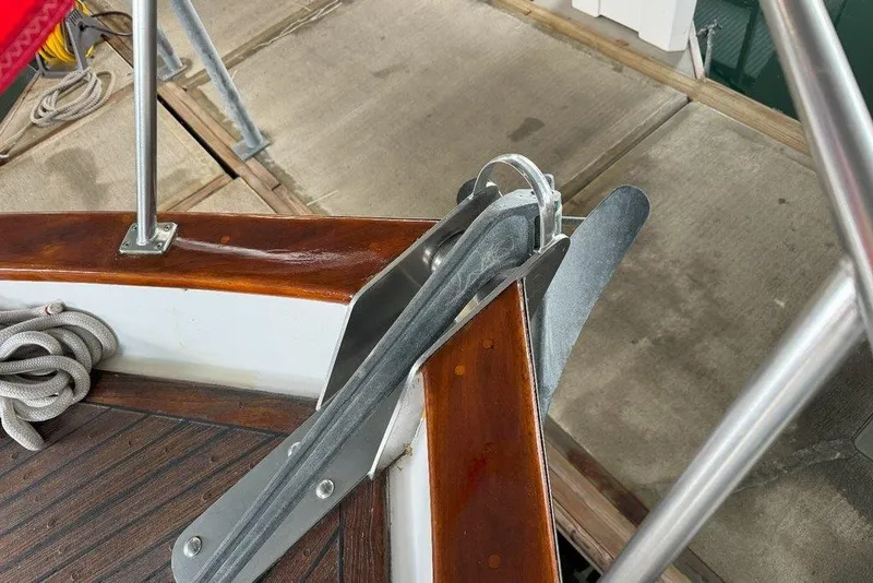 Slide: The Image of Anchor setup on 1983 Ocean Alexander 40 Europa boat, featuring polished wood and metal fittings. - 34