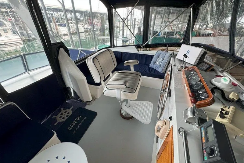 Slide: The Image of Interior view of 1983 Ocean Alexander 40 Europa yacht cockpit with seating and controls. - 40