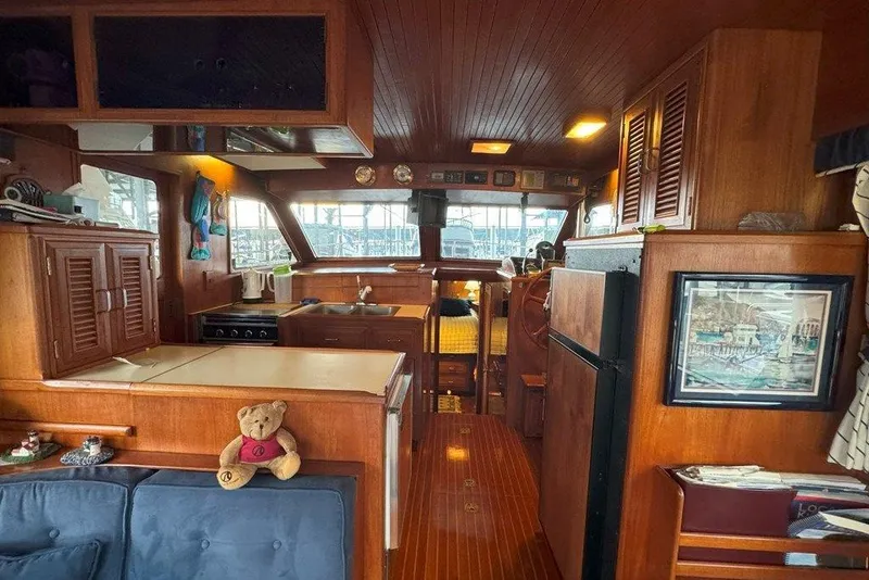 Slide: The Image of Interior of 1983 Ocean Alexander 40 Europa yacht with wooden cabinetry and nautical decor. - 7