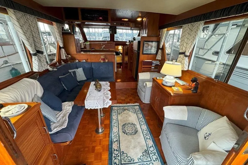 Slide: The Image of Interior of 1983 Ocean Alexander 40 Europa yacht with cozy seating and elegant decor. - 3