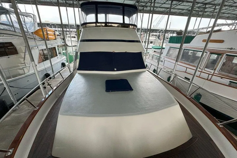 Slide: The Image of 1983 Ocean Alexander 40 Europa yacht docked in a marina, showcasing its sleek design. - 35
