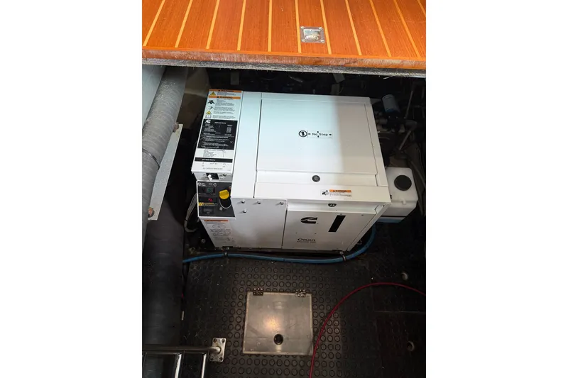 Slide: The Image of Engine room of a 2005 North Pacific 42 boat with Cummins Onan generator. - 67