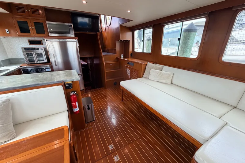 Slide: The Image of Luxurious interior of 2005 North Pacific 42 yacht with modern kitchen and comfortable seating. - 22