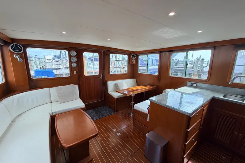 Slide: The Image of Interior of 2005 North Pacific 42 yacht with elegant wood finish and modern amenities. - 15