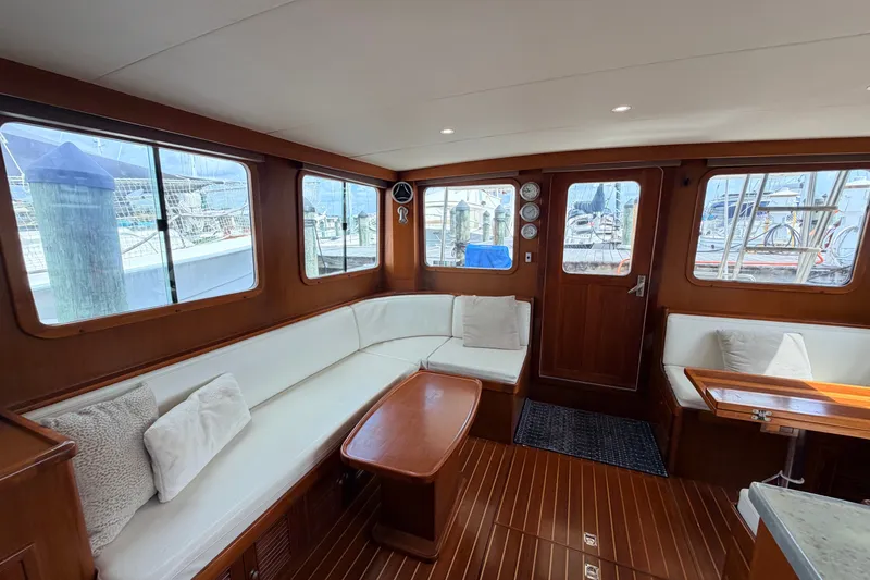 Slide: The Image of Interior of 2005 North Pacific 42 yacht with elegant wood finish and comfortable seating. - 14