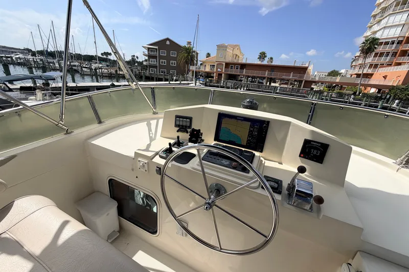 Slide: The Image of Helm of 2005 North Pacific 42 yacht with navigation equipment, docked at marina. - 44