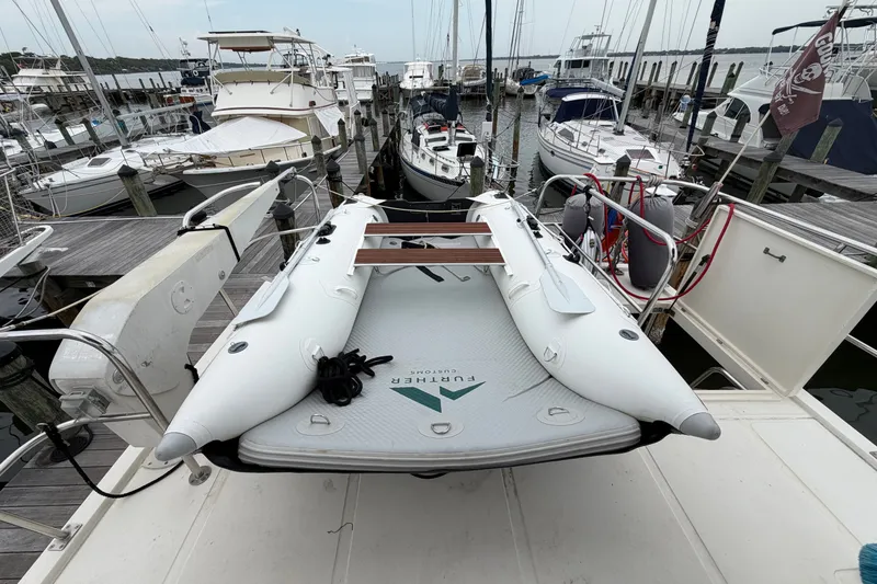 Slide: The Image of Docked North Pacific 42 yacht from 2005 with inflatable boat on deck. - 49