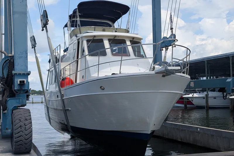 Slide: The Image of 2005 North Pacific 42 yacht in dry dock, showcasing its sleek design and sturdy build. - 70