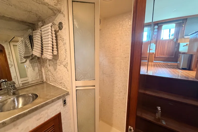 Slide: The Image of Bathroom interior of 2005 North Pacific 42 yacht with sink, mirror, and shower. - 40