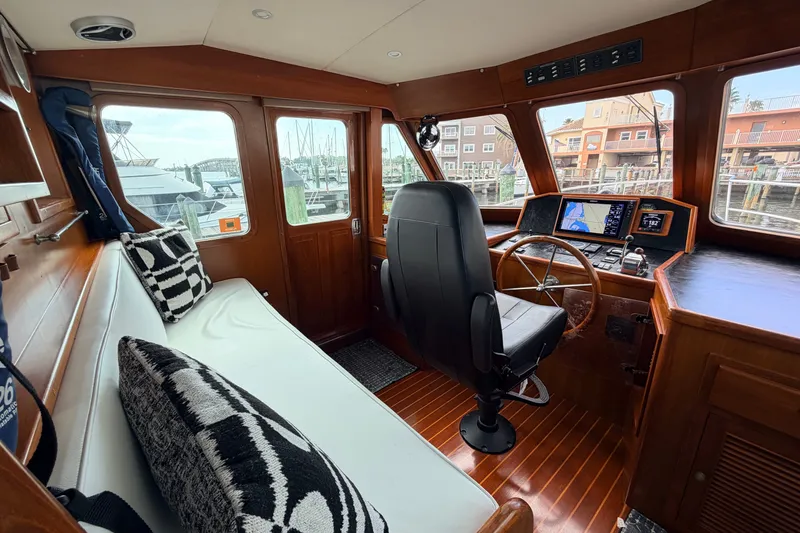 Slide: The Image of Interior of 2005 North Pacific 42 boat with helm, seating, and navigation equipment. - 26