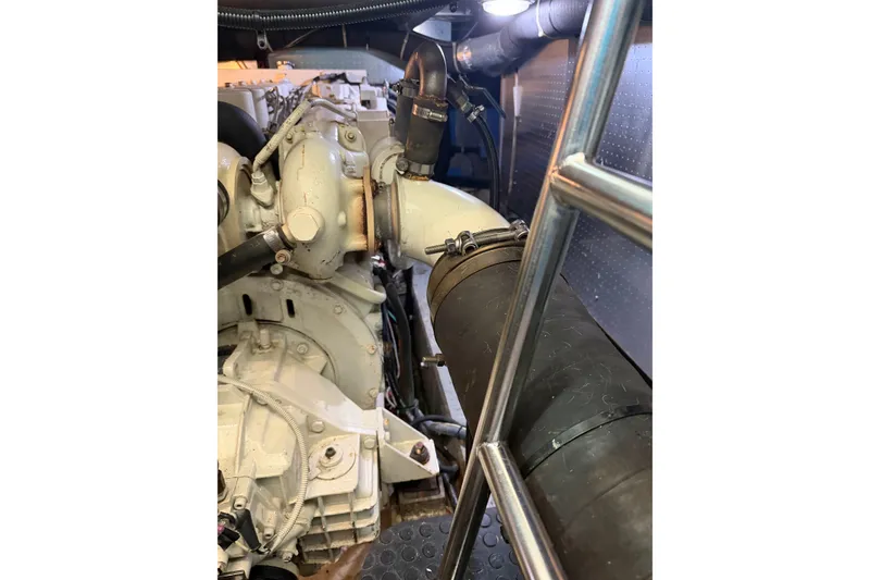 Slide: The Image of Engine room of a 2005 North Pacific 42 boat, showcasing mechanical components. - 57