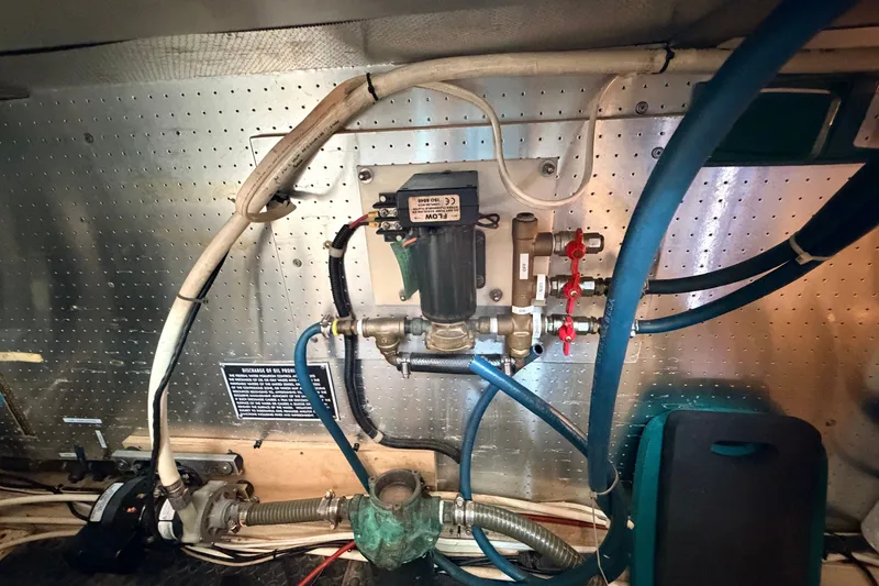 Slide: The Image of Engine room plumbing system of a 2005 North Pacific 42 boat. - 63