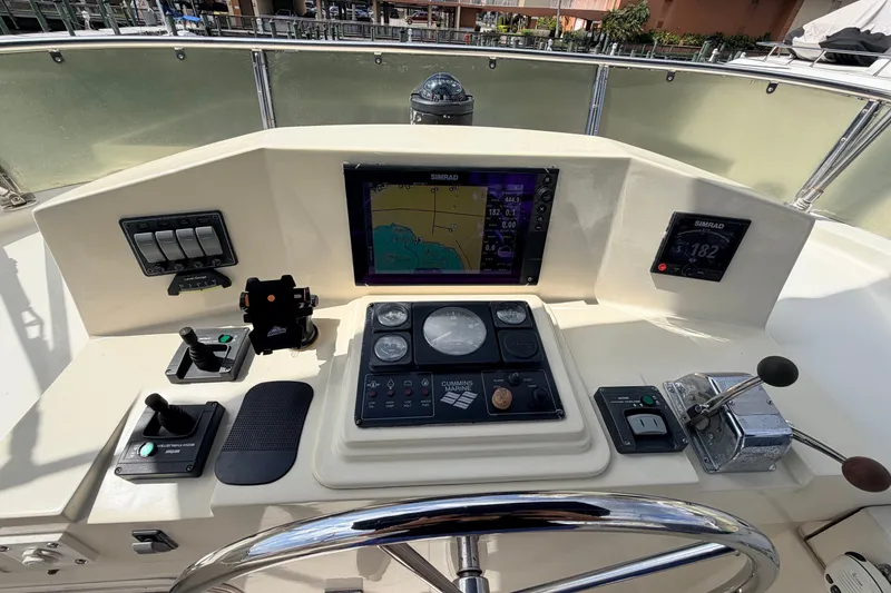 Slide: The Image of Helm of 2005 North Pacific 42 boat with navigation controls and display. - 43