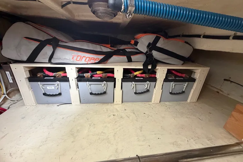 Slide: The Image of Battery storage area in a 2005 North Pacific 42 boat, featuring Torqeedo equipment. - 69