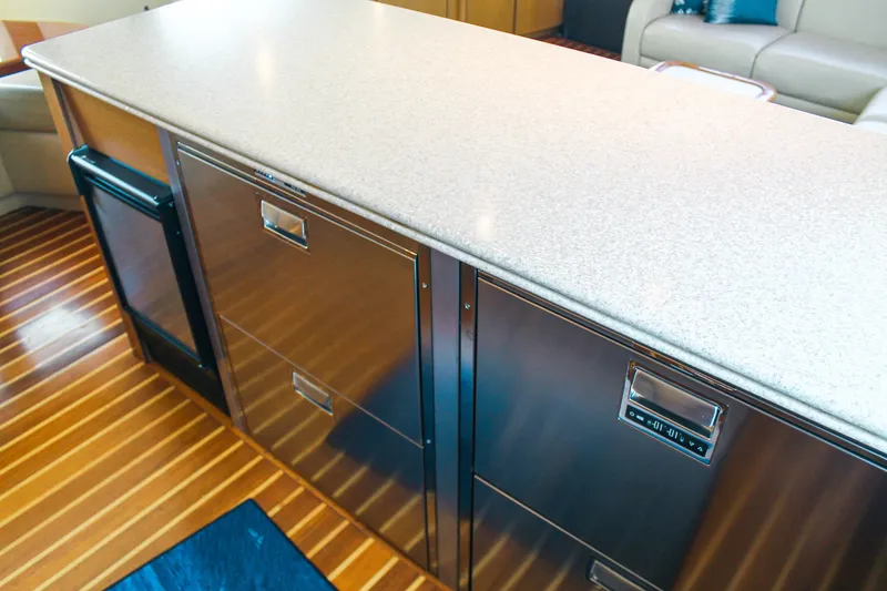 Slide: The Image of Luxurious interior of 2002 Ocean Yachts 56 Super Sport with sleek cabinetry and wood flooring. - 28