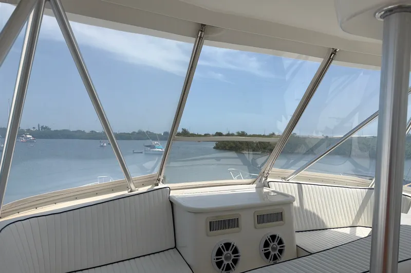 Slide: The Image of Interior view of 2002 Ocean Yachts 56 Super Sport, overlooking serene waters. - 45