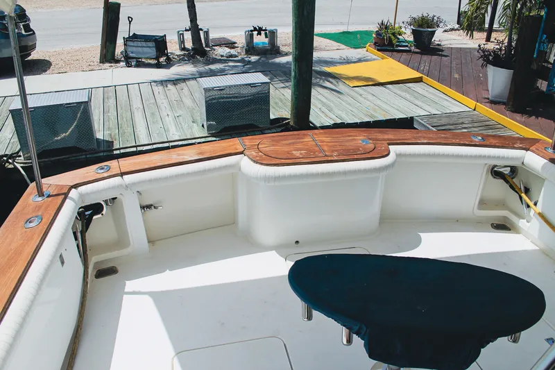 Slide: The Image of 2002 Ocean Yachts 56 Super Sport cockpit with wooden trim and seating area. - 38