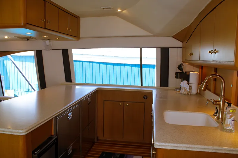 Slide: The Image of Luxurious kitchen interior of 2002 Ocean Yachts 56 Super Sport with modern amenities. - 17