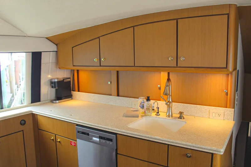 Slide: The Image of Luxurious kitchen interior of 2002 Ocean Yachts 56 Super Sport with modern amenities. - 18