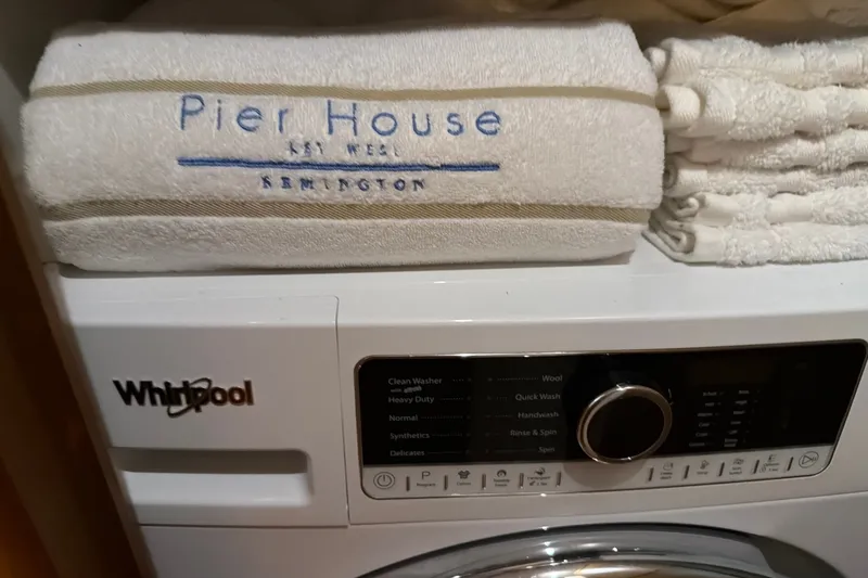 Slide: The Image of Whirlpool washing machine with folded Pier House towels, Ocean Yachts 56 Super Sport, 2002. - 35
