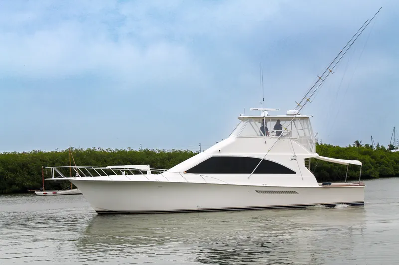 The Image of 2002 Ocean Yachts 56 Super Sport cruising on calm waters. - 0