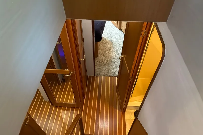 Slide: The Image of Interior view of 2002 Ocean Yachts 56 Super Sport, featuring wooden flooring and open doors. - 33