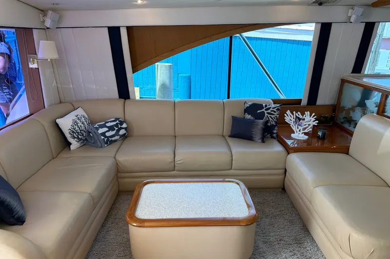 Slide: The Image of Luxurious interior of 2002 Ocean Yachts 56 Super Sport with beige leather seating and nautical decor. - 15