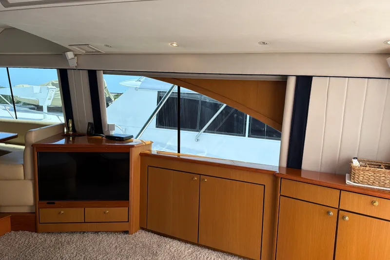 Slide: The Image of Luxurious interior of a 2002 Ocean Yachts 56 Super Sport with elegant wood cabinetry. - 16