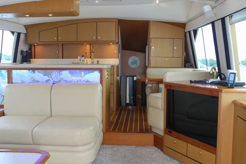 Slide: The Image of Luxurious interior of a 2002 Ocean Yachts 56 Super Sport with elegant wood cabinetry. - 13