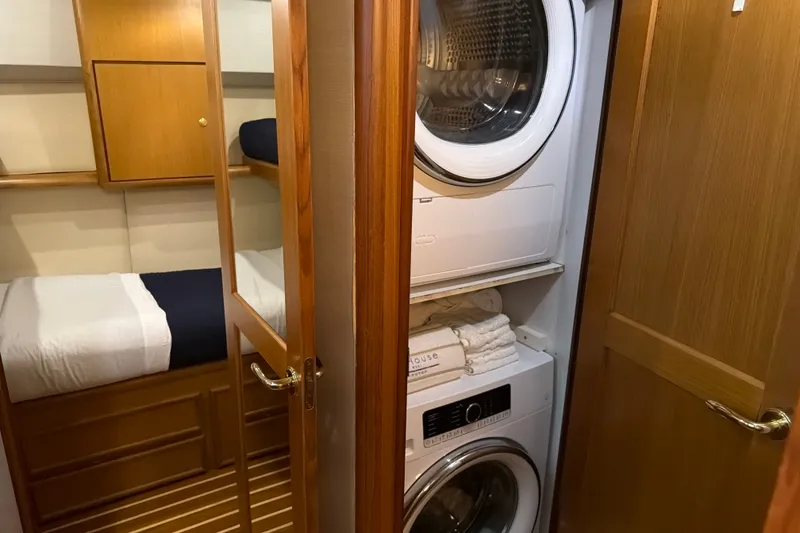 Slide: The Image of Laundry area and cabin in 2002 Ocean Yachts 56 Super Sport boat interior. - 34