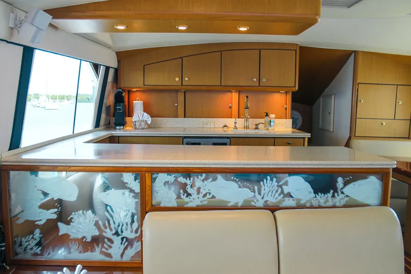 Slide: The Image of Luxurious interior of 2002 Ocean Yachts 56 Super Sport with elegant kitchen design. - 14
