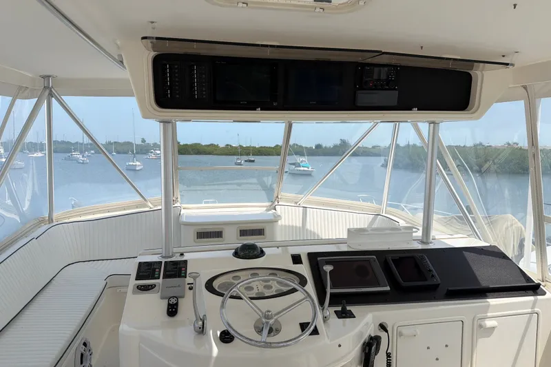 Slide: The Image of 2002 Ocean Yachts 56 Super Sport helm with panoramic water view and navigation equipment. - 41