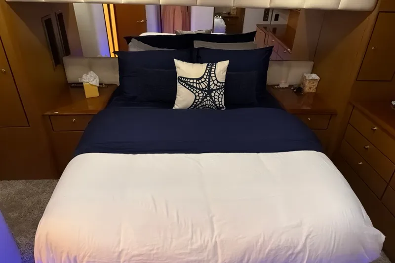 Slide: The Image of Luxurious bedroom interior of 2002 Ocean Yachts 56 Super Sport with elegant bedding. - 23