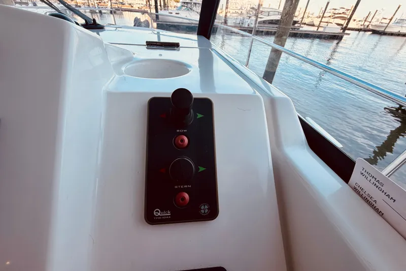 Slide: The Image of Control panel on a 2019 Beneteau Swift Trawler 30, docked at a marina. - 23