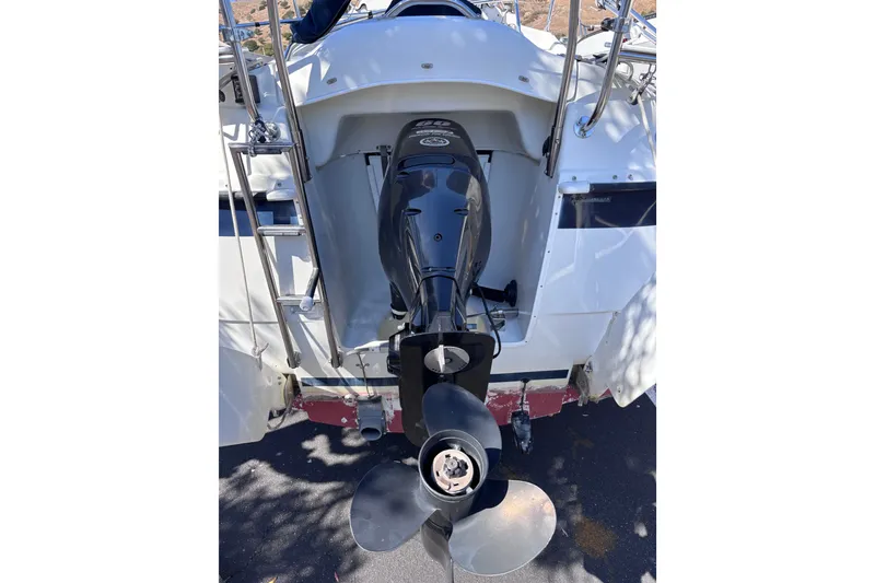 Slide: The Image of Rear view of a 2014 Tattoo 26 boat with an outboard motor. - 22