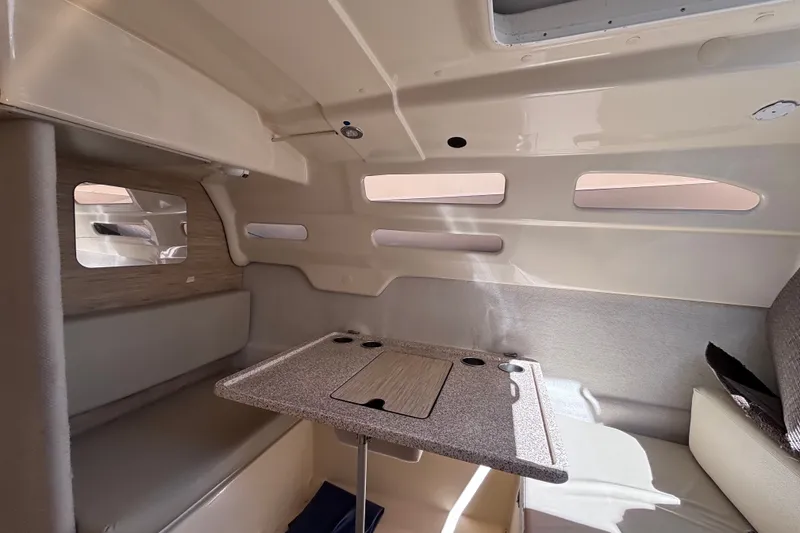Slide: The Image of Cozy interior of a 2014 Tattoo 26 sailboat with seating and table. - 12